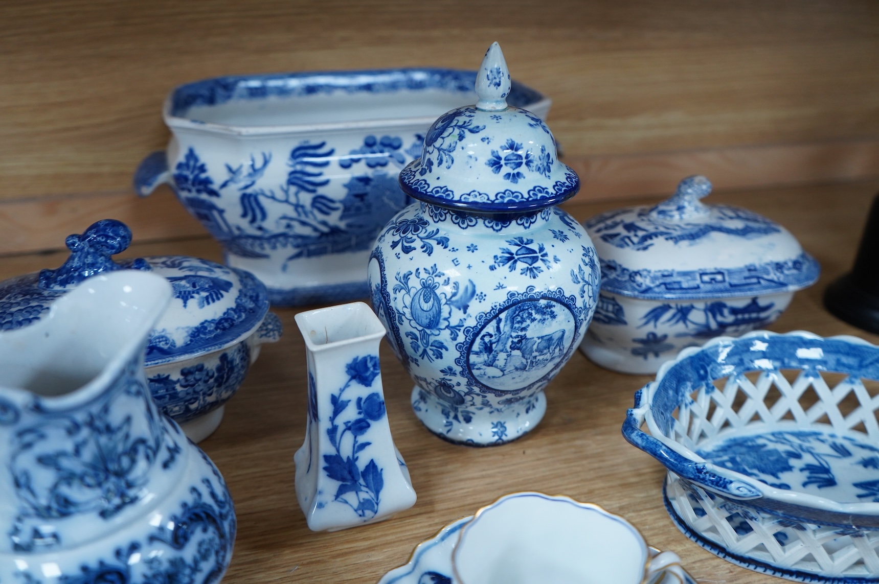 A group of blue and white Willow pattern china, 19th century and later and a Meissen cup and. Saucer. (12).